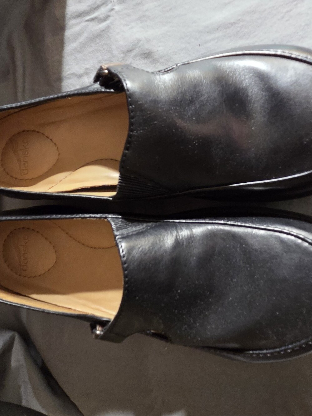 Dansko Black Leather Slip-On Loafers